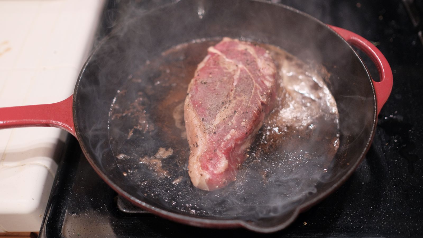 Hands preparing food in a professional kitchen