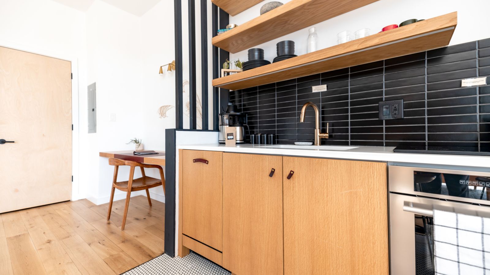 Minimal kitchen with neatly installed floating wooden shelves