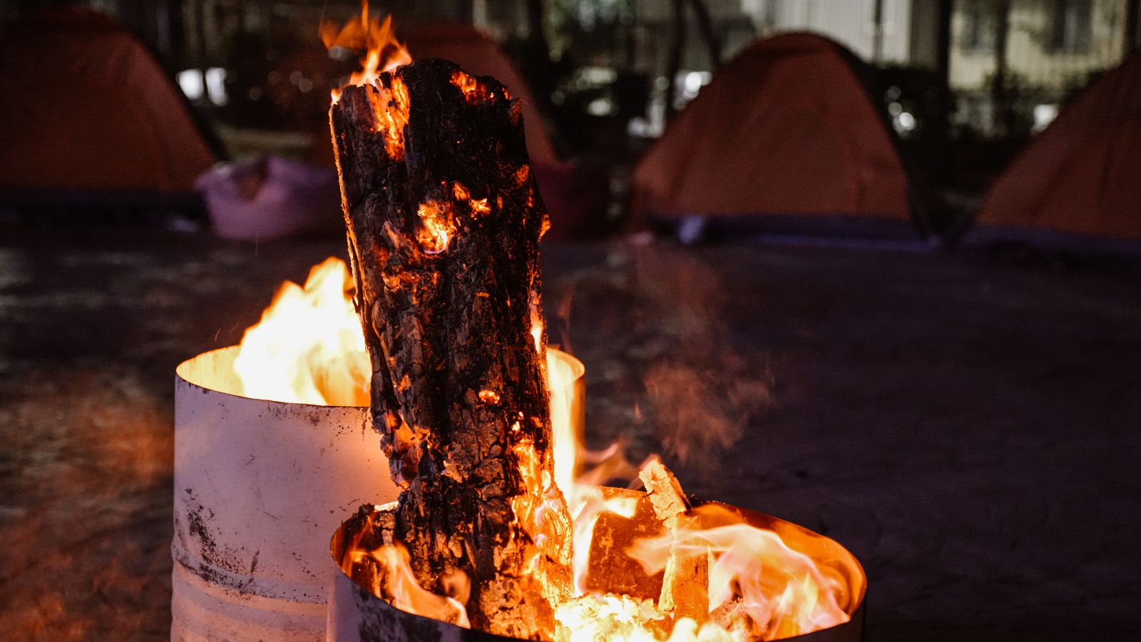 Well-controlled backyard-style fire with seating at a campsite