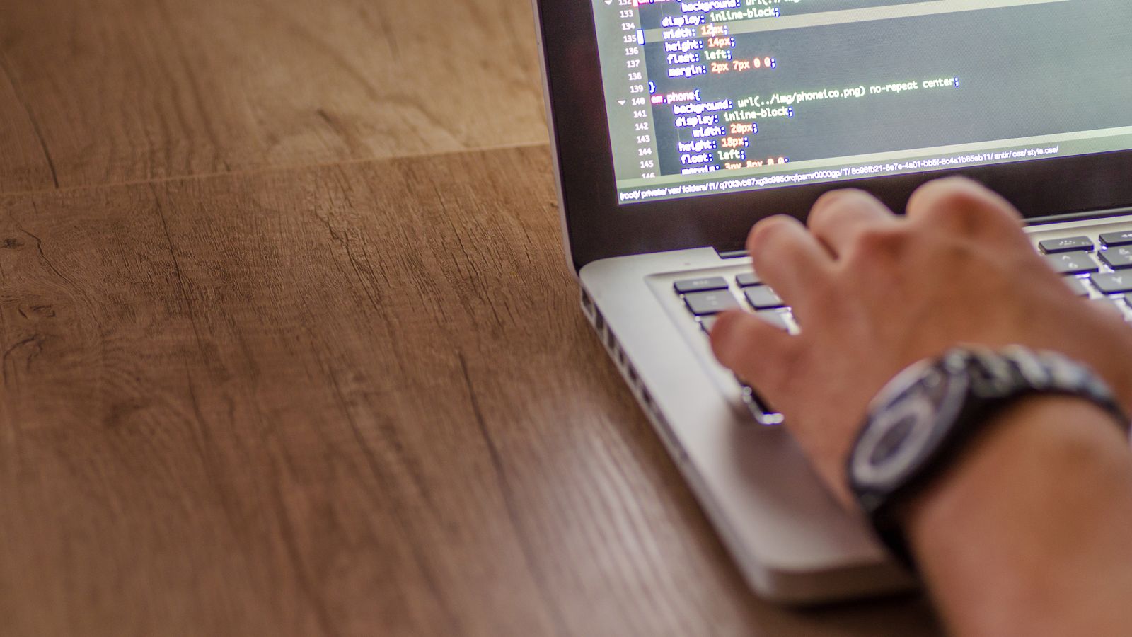 Person working with software on a laptop
