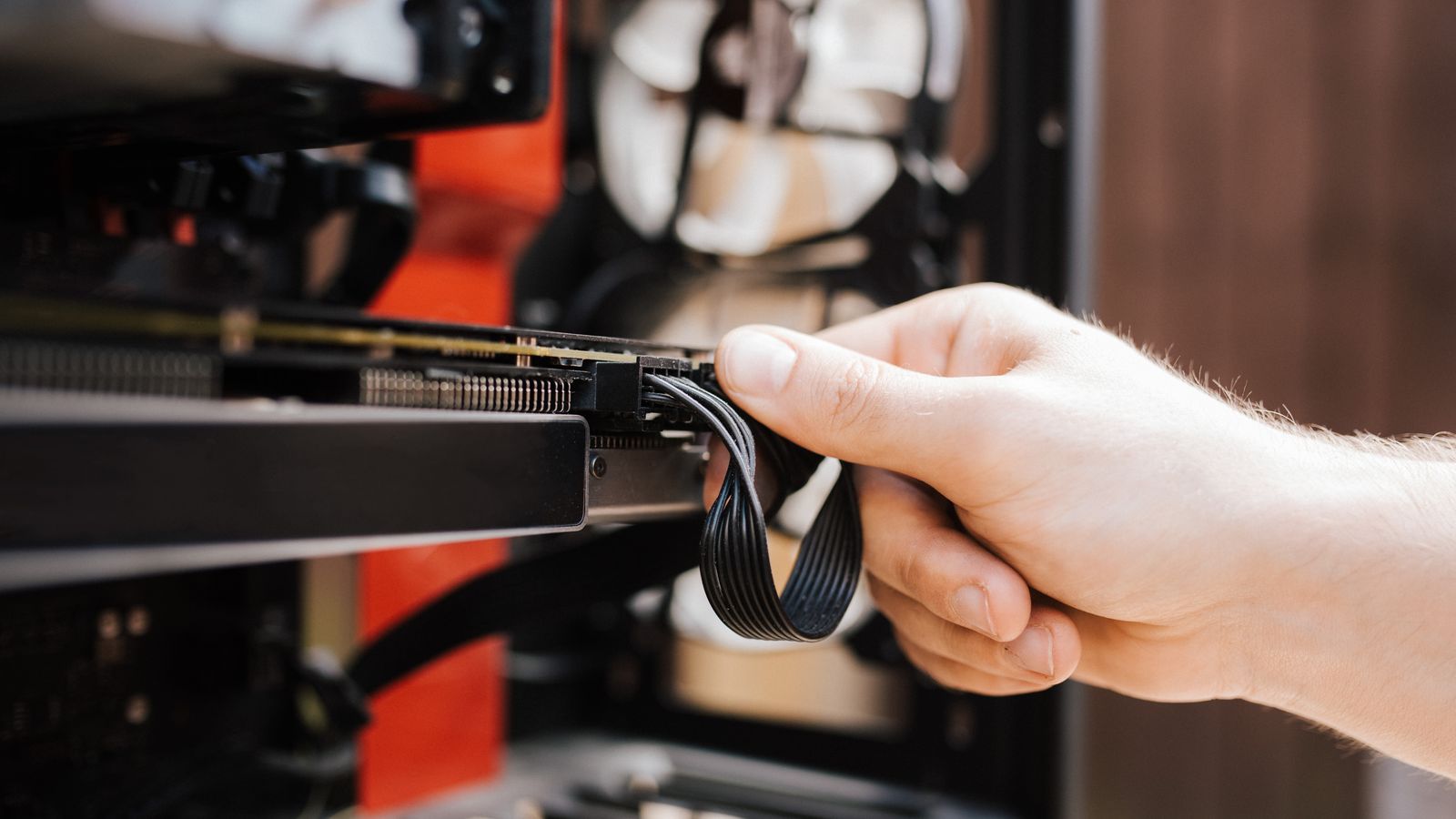 Careful hands working inside a computer